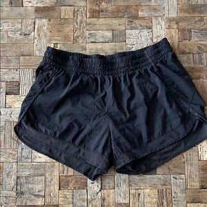 Athleta Black Mesh Racer Run 4” size Large